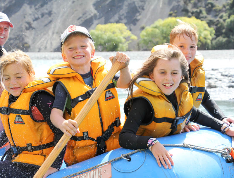 A family group paddling together
